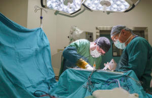 Neurosurgeon team operating brain tumor surgery in hospital