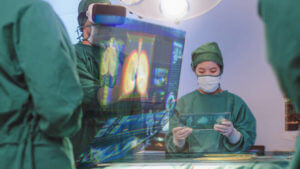 Surgeons using VR and hologram modern virtual screen interface Respiratory System in the operating room, innovative and future of medical and healthcare technology