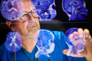 surgeon analysing scans with the latest advancements in neurosurgery