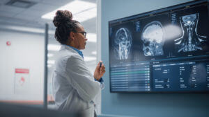 Neurosurgeon analysing patients MRI scan before Neurosurgery