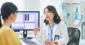 spine surgeon explaining to patient the procedure