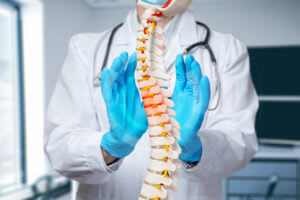 A spine surgeon explains the disease of the spine while discussing the Minimally Invasive Surgery procedure.